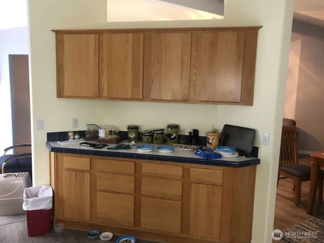 a kitchen with a sink and cabinets