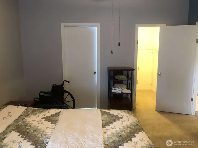 a bedroom with a bed and a dresser