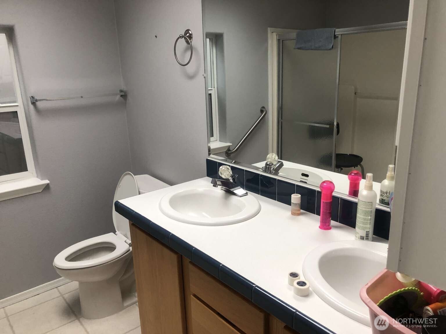 540 North 7th Avenue, Unit 54 Sequim, WA 98382 - Photo 18 of 21 a bathroom with a sink vanity mirror and toilet