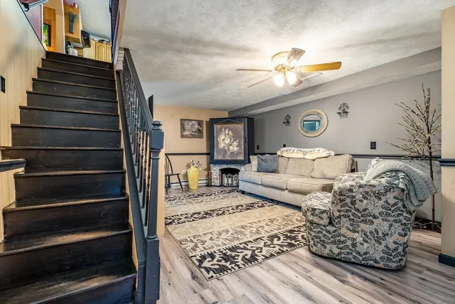 a living room with furniture and a rug