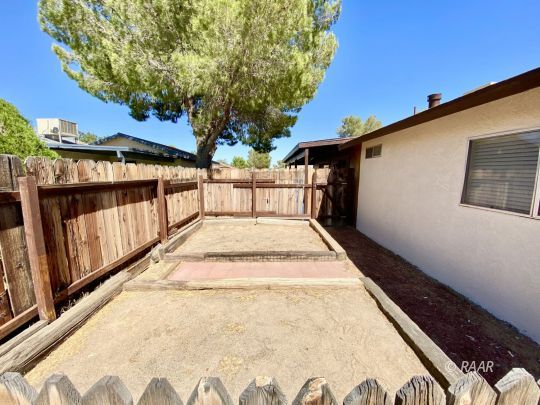 401 South Fountain Street Ridgecrest, CA 93555 - Photo 25 of 29 a view of balcony with wooden floor and fence