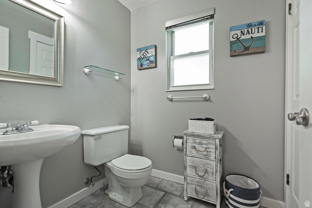 3310 Creek Road Salt Lake City, UT 84121 - Photo 34 of 49 Bathroom featuring a pedestal sink, white toilet, and a window with blinds