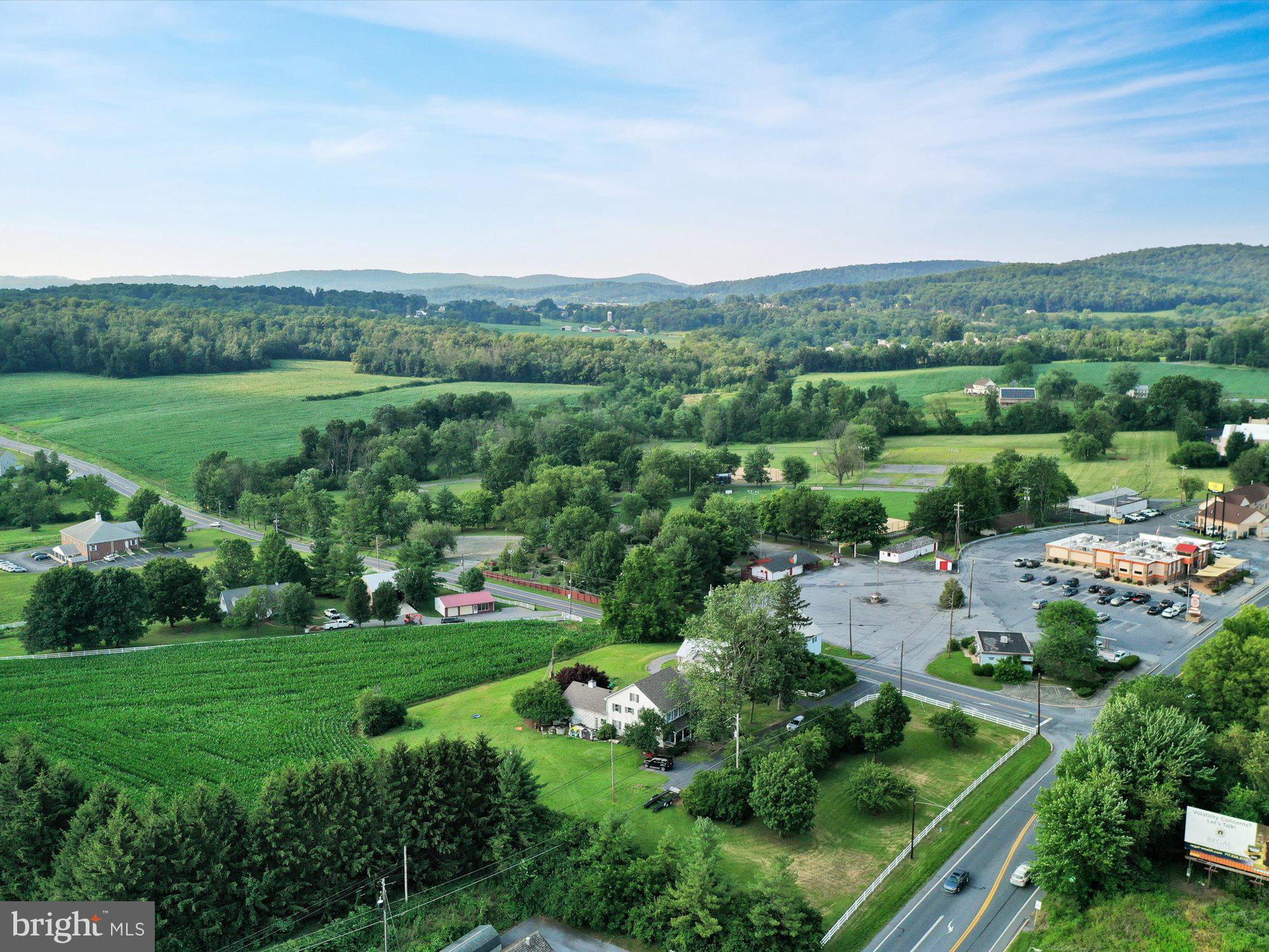 20 Hill Road Denver, PA 17517 - Photo 20 of 25 an aerial view of green landscape with trees houses and mountain view