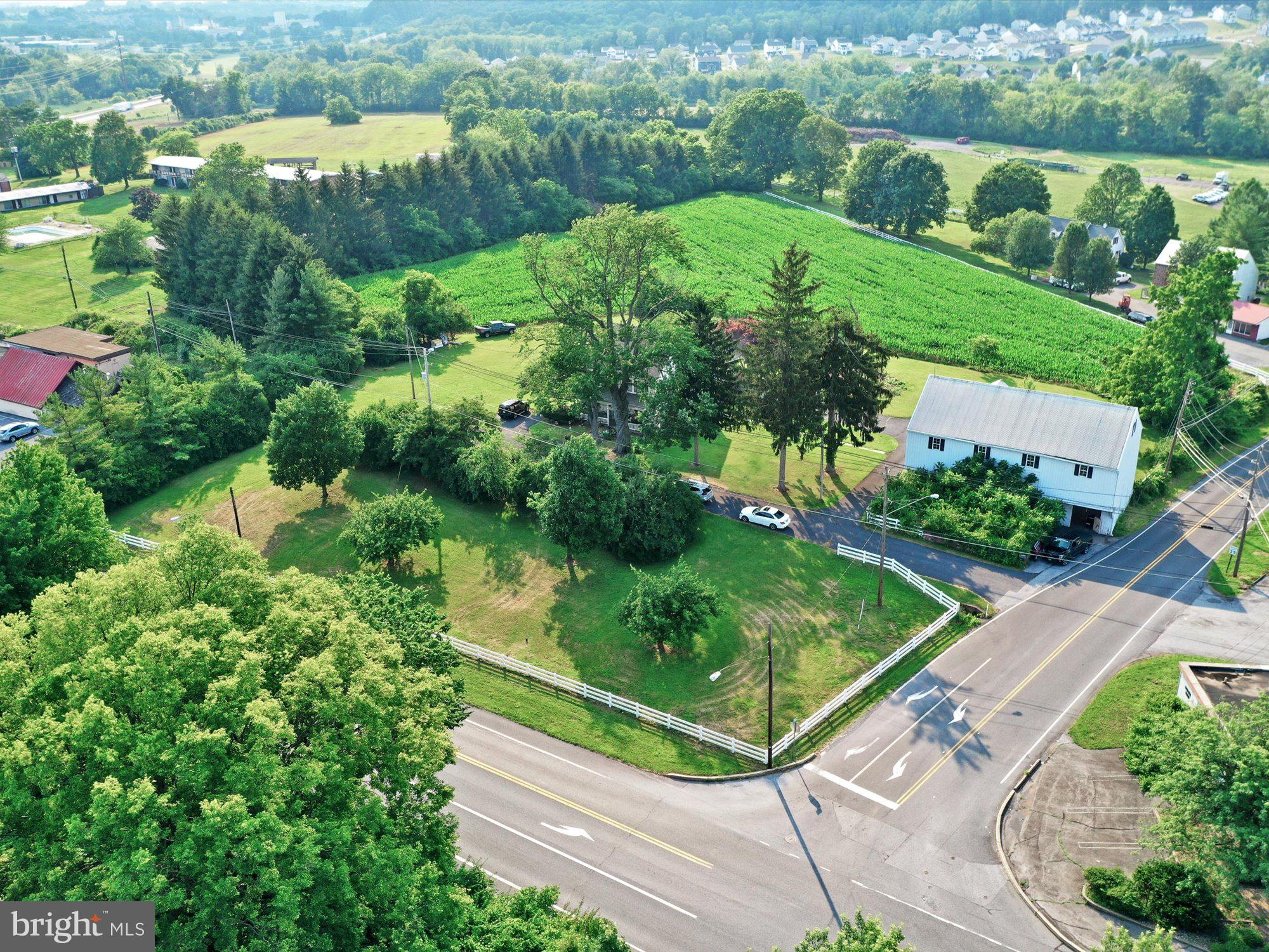 20 Hill Road Denver, PA 17517 - Photo 21 of 25 an aerial view of green landscape with trees houses and wooden fence