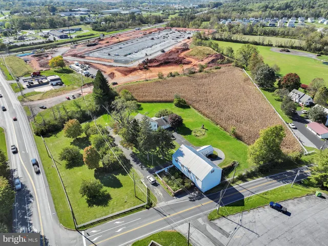 an aerial view of a house with a garden