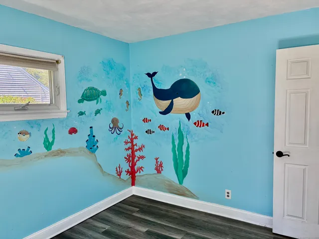 a room with toys and wooden floor