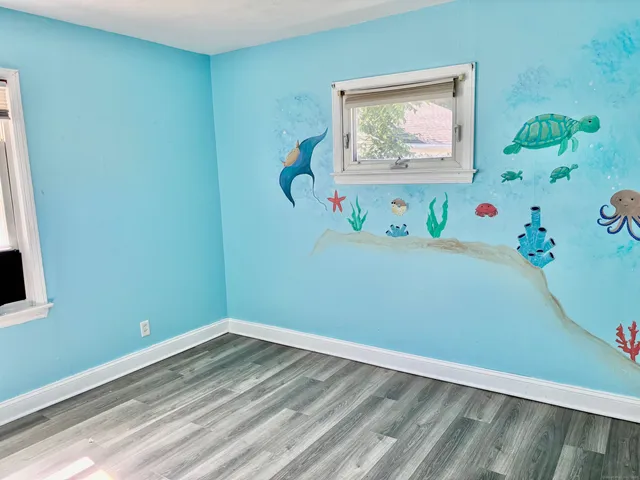 a room with a painting on the wall