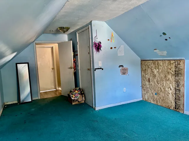 a view of room with window and stairs