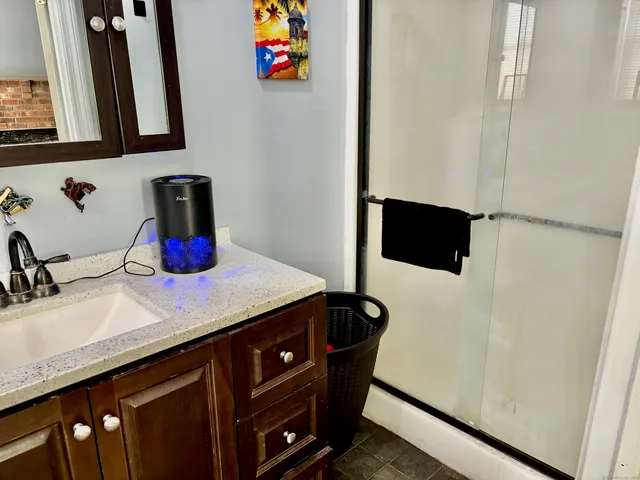 a bathroom with a sink and a mirror