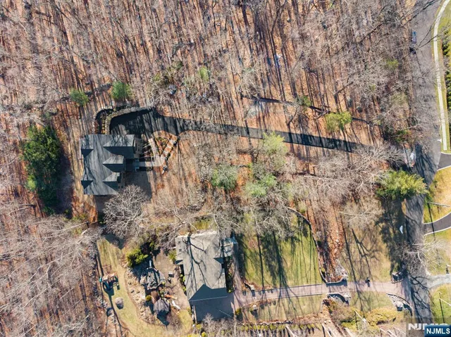 a view of staircase with white walls and a black white checkered floor