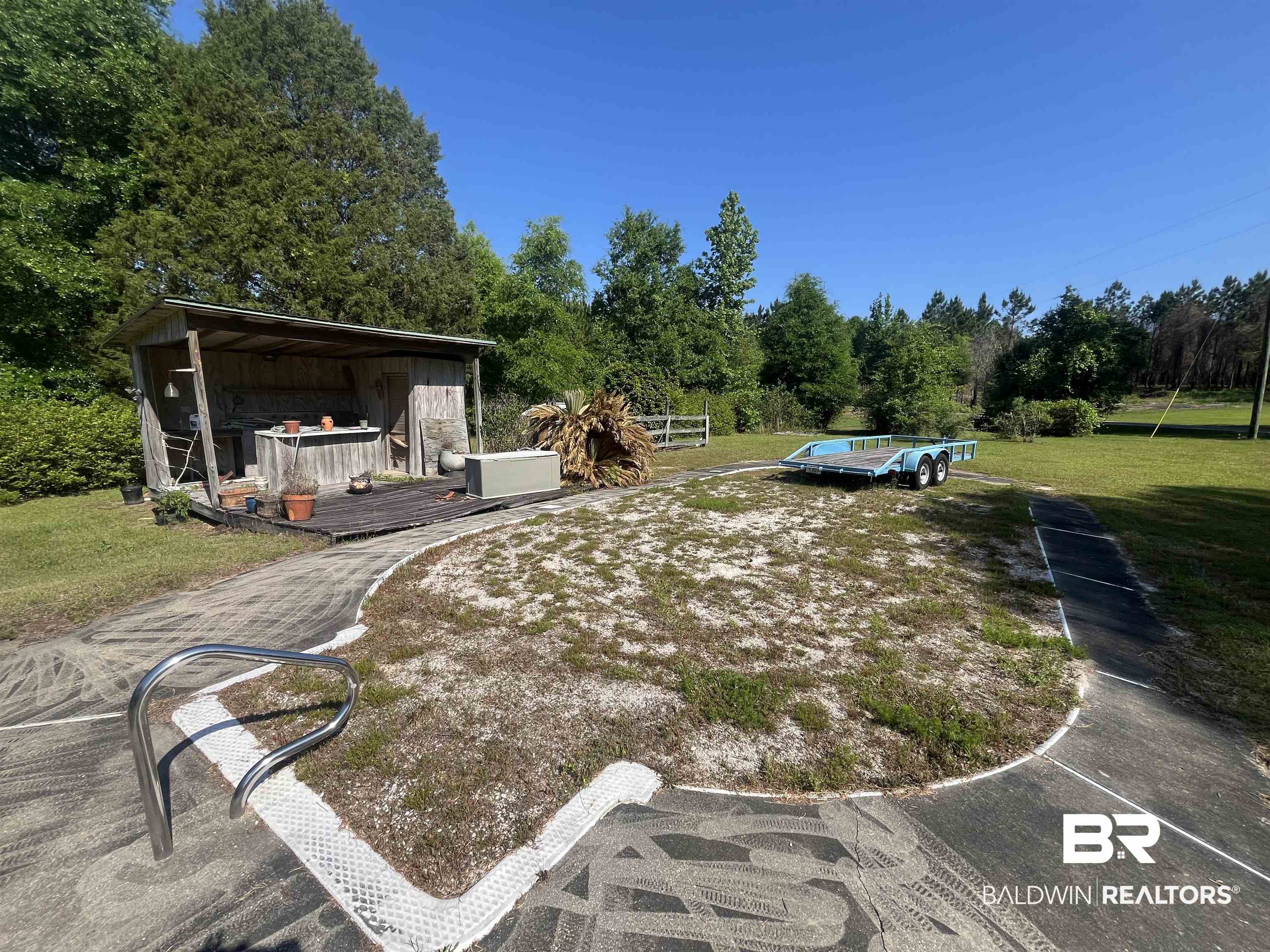 315 Dawkins Road Brewton, AL 36426 - Photo 7 of 19 View of yard featuring a deck