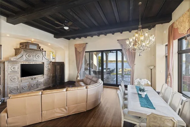 a living room with furniture window and wooden floor