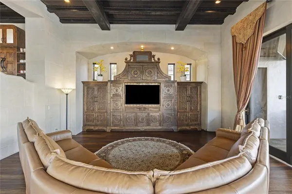 a living room with fireplace furniture and a flat screen tv