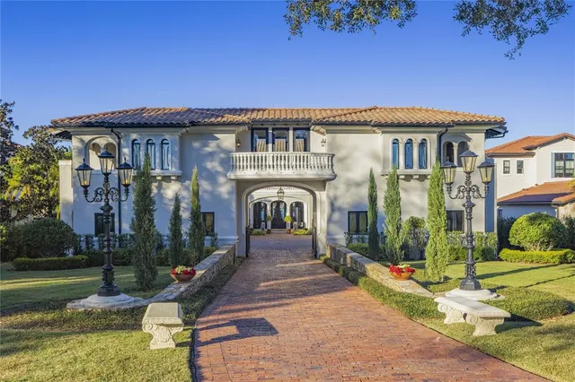 a view of a house with backyard porch and sitting area
