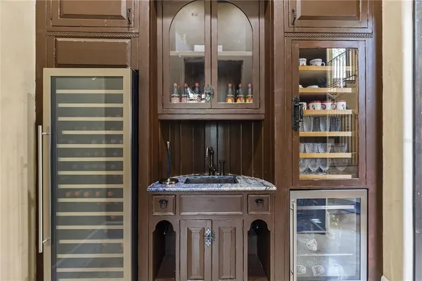 a bathroom with a granite countertop sink toilet a mirror and shower