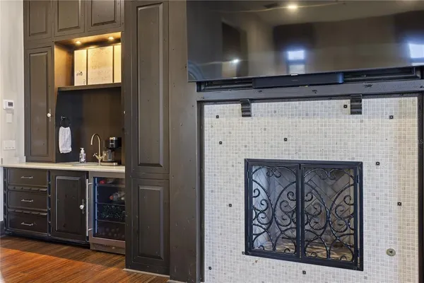 an aerial view of a house with a garden and lake view