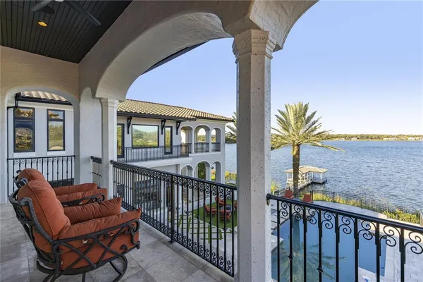 a view of a house with couches on the deck
