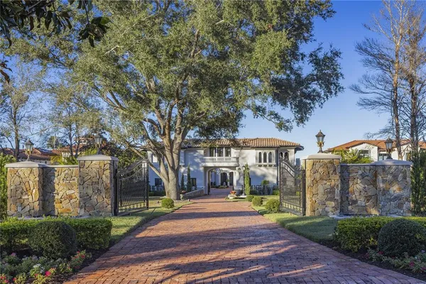 a front view of a house with a garden and porch