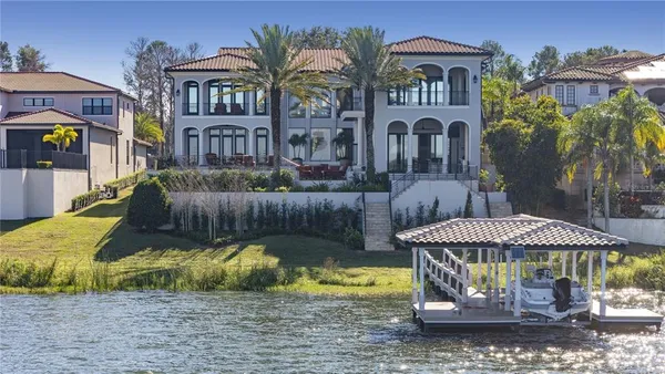 an aerial view of a house with a garden and swimming pool
