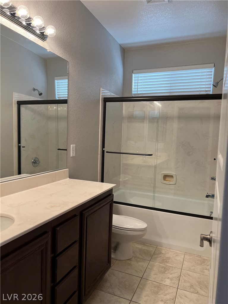 5981 Honeysuckle Ridge Street Las Vegas, NV 89148 - Photo 9 of 29 A well-appointed bathroom offers a convenient vanity, shower, and tile flooring.