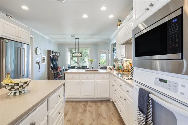 a kitchen with a sink and a stove top oven