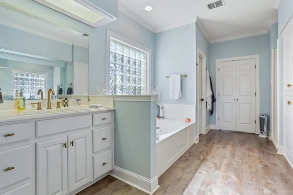 a bathroom with a bathtub and a sink
