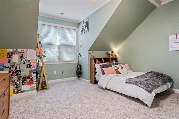 a bedroom with a bed and couch