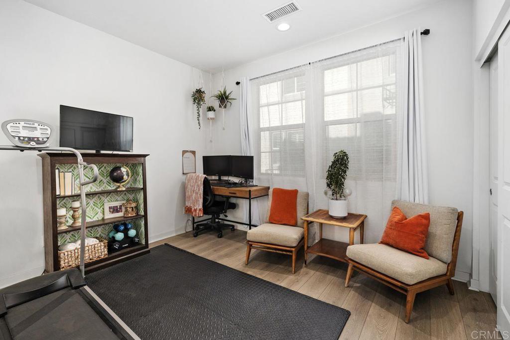 305 Cricket Court Santee, CA 92071 - Photo 15 of 25 a living room with furniture a flat screen tv and a fireplace