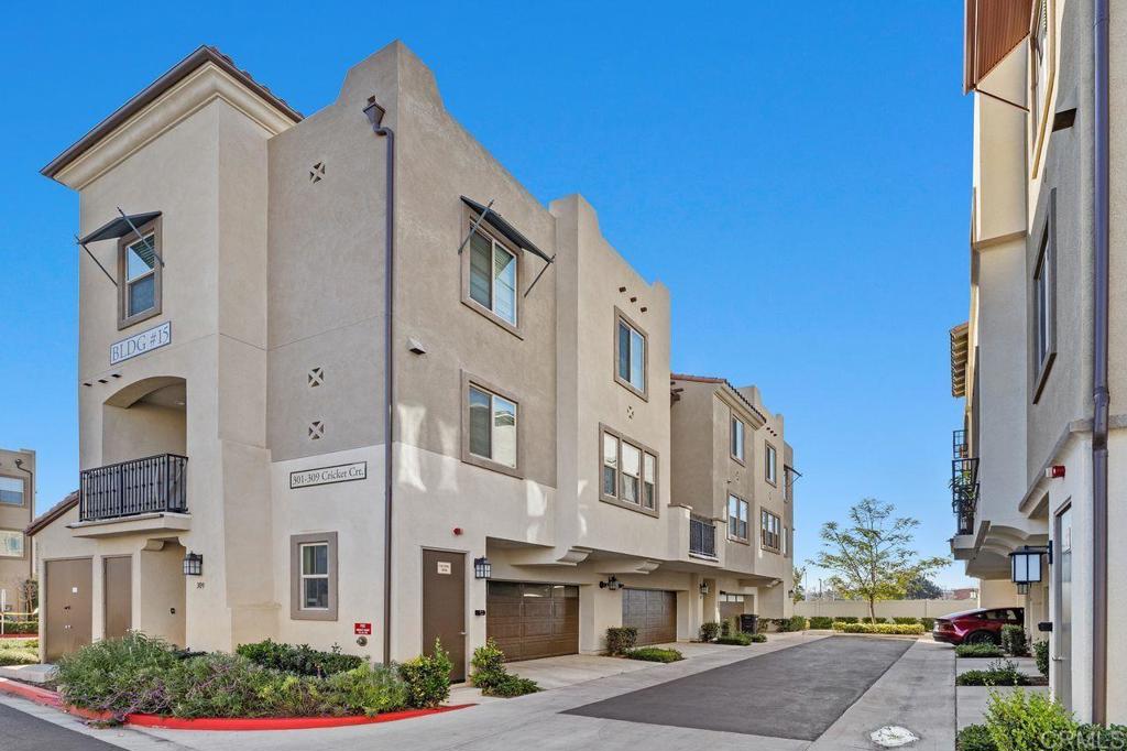 305 Cricket Court Santee, CA 92071 - Photo 20 of 25 a front view of a building with lot of cars and trees