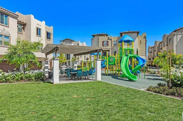 a view of a chairs and table in a backyard