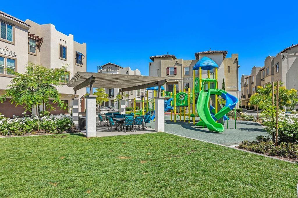 305 Cricket Court Santee, CA 92071 - Photo 21 of 25 a view of a chairs and table in a backyard