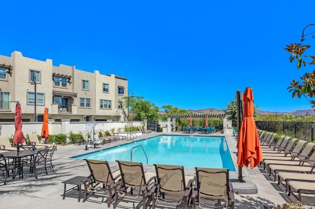 305 Cricket Court Santee, CA 92071 - Photo 22 of 25 a view of a swimming pool with outdoor seating and plants