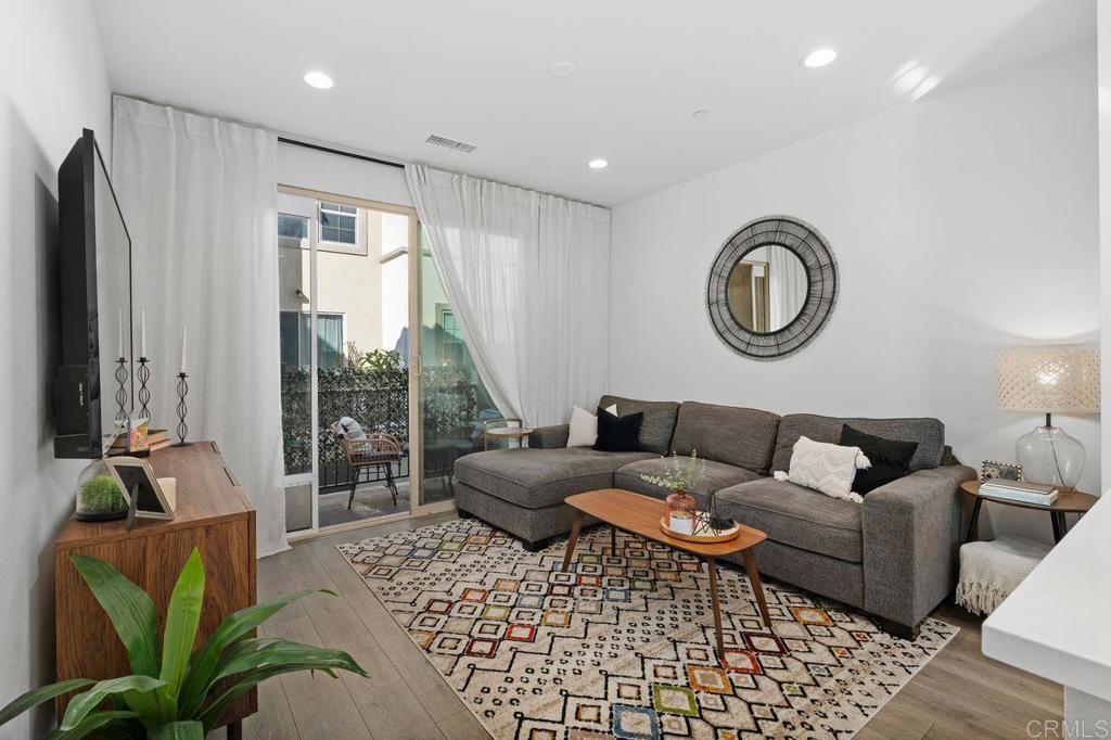 305 Cricket Court Santee, CA 92071 - Photo 9 of 25 a living room with furniture a window and a rug