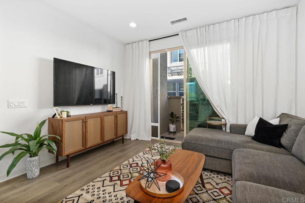 305 Cricket Court Santee, CA 92071 - Photo 10 of 25 a living room with furniture and a flat screen tv