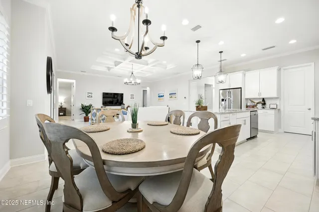 a view of a dining room and livingroom with furniture