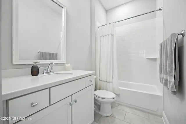 a bedroom with a bed and dresser