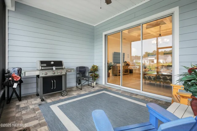 a view of swimming pool and outdoor seating