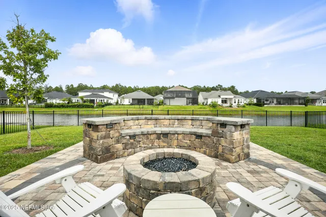 a view of a lake with houses in the background