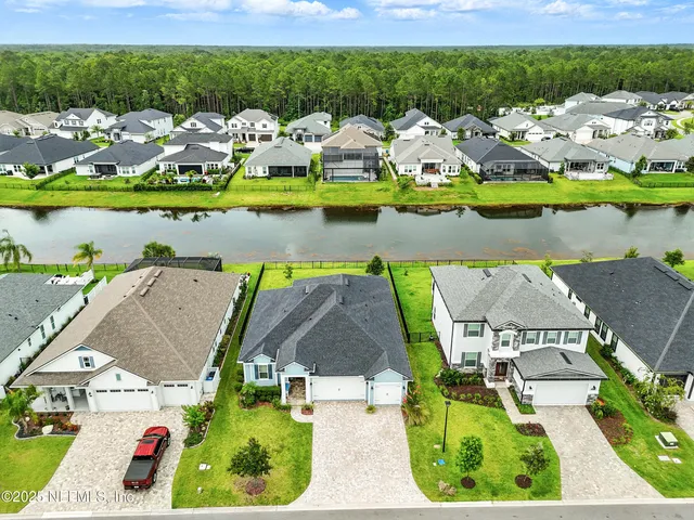 an aerial view of a house with a garden