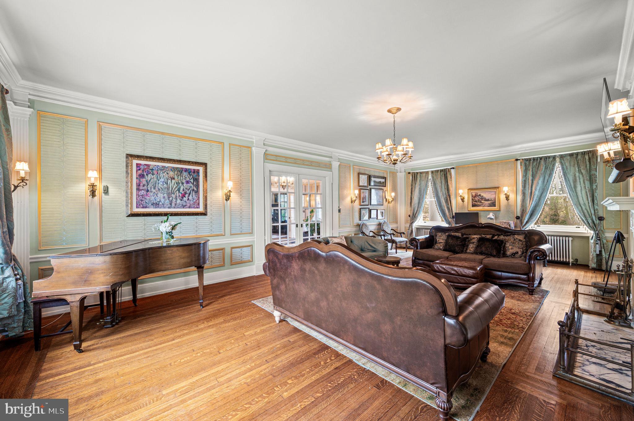 1018 Beech Road Wallingford, PA 19086 - Photo 7 of 66 a living room with furniture and a chandelier