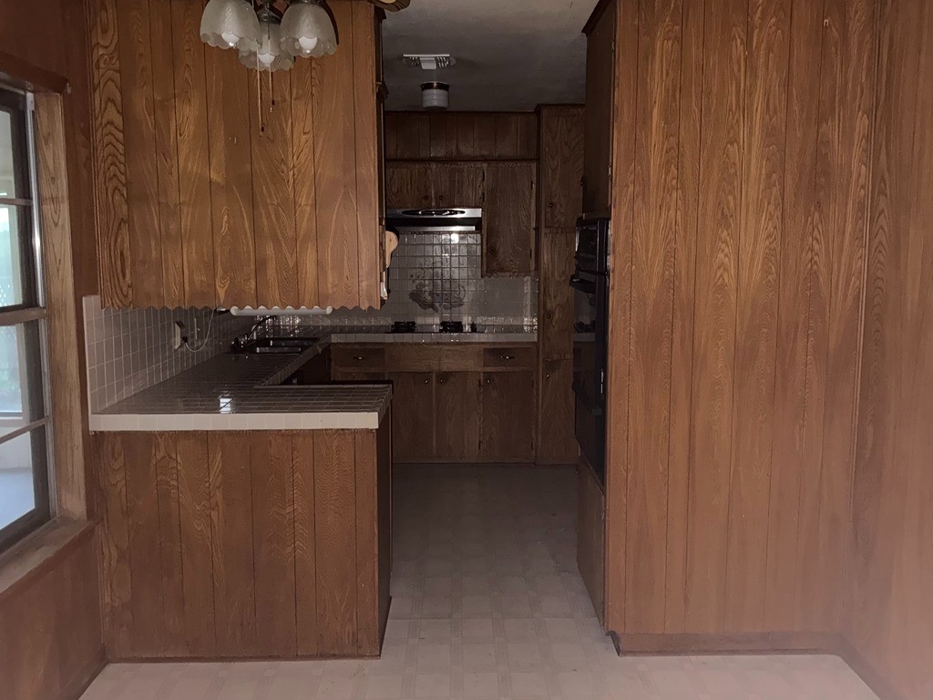 2302 Kent Street Bryan, TX 77802 - Photo 13 of 21 a kitchen with a sink and cabinets