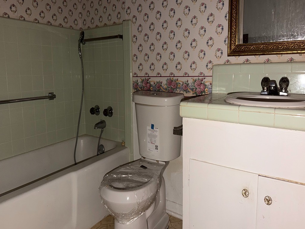 2302 Kent Street Bryan, TX 77802 - Photo 19 of 21 a kitchen with a sink a refrigerator and cabinets