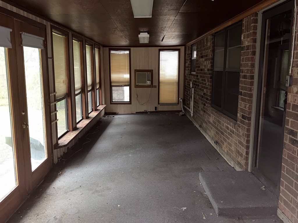 2302 Kent Street Bryan, TX 77802 - Photo 7 of 21 a view of empty room with floor to ceiling window and stairs
