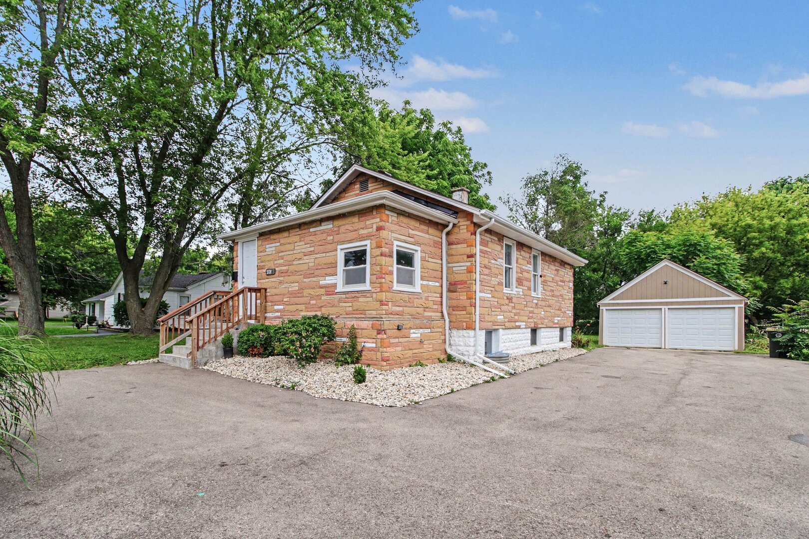 208 West Nippersink Road Round Lake, IL 60073 - Photo 1 of 18 a view of a house with a yard and garage