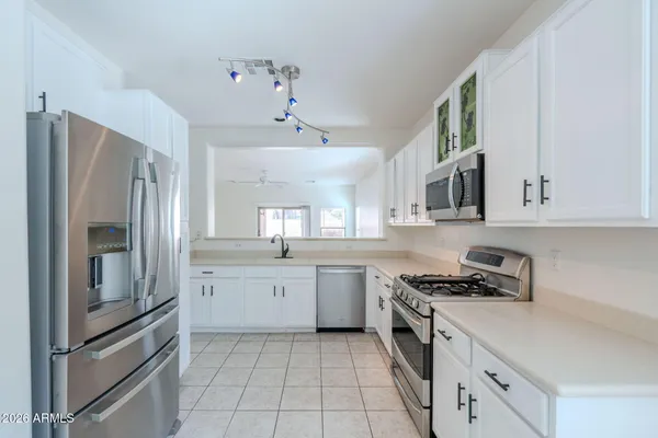 a kitchen with cabinets and appliances