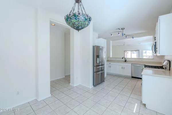 a kitchen with stainless steel appliances a refrigerator and a sink
