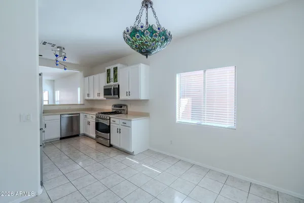 a kitchen with a refrigerator and a sink