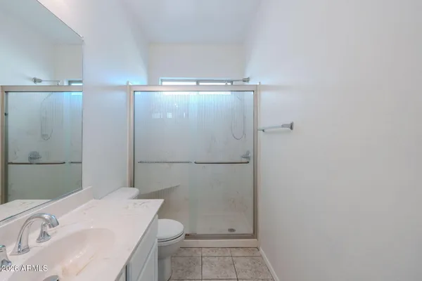 a bathroom with a sink and toilet