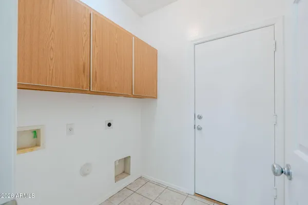 a view of an empty room with a cabinet