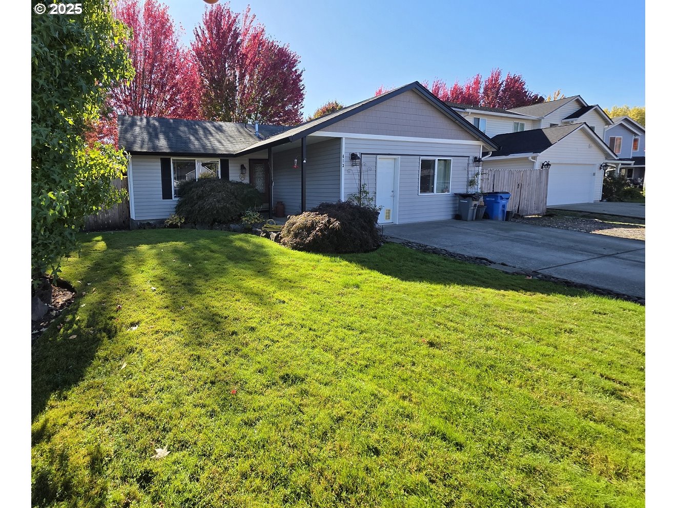 413 Southeast 8th Street Battle Ground, WA 98604 - Photo 1 of 18 a front view of a house with garden